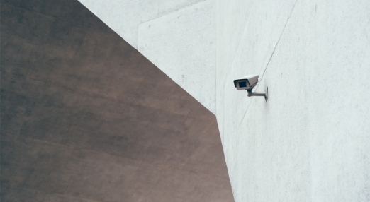 An image showing a surveillance camera on a building