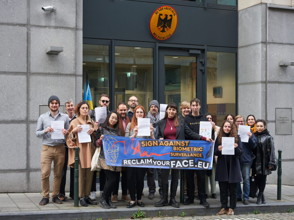 The Reclaim Your Face group photo in front of the German Permanent Representation to the EU, delivering an open letter