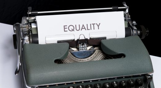 Typewriter displaying the words 'equality'