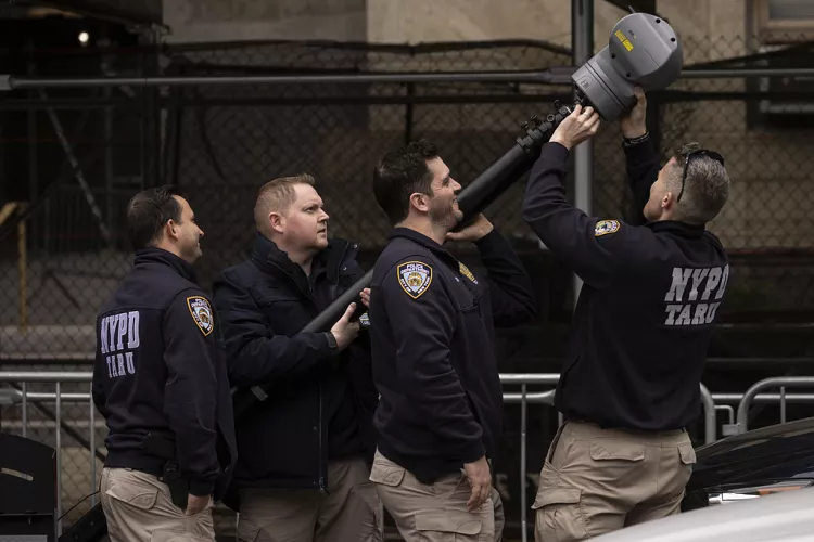 New York Police personnel set up a surveillance camera outside Manhattan Criminal Court in New York, 31 March 2023