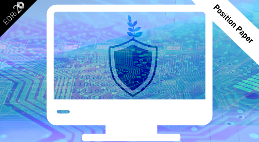 A computer screen with the silhouette of a shield and a plant growing out of it to symbolise security and sustainability. The background is green-blue circuitry.